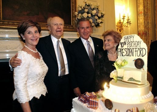 Ford at his 90th birthday with Laura Bush, President George W. Bush, and Betty Ford in the White House State Dining Room in 2003