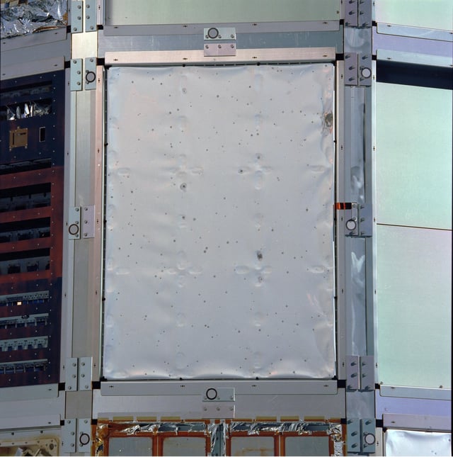 Teflon thermal cover showing impact craters, from NASA's Ultra Heavy Cosmic Ray Experiment (UHCRE)