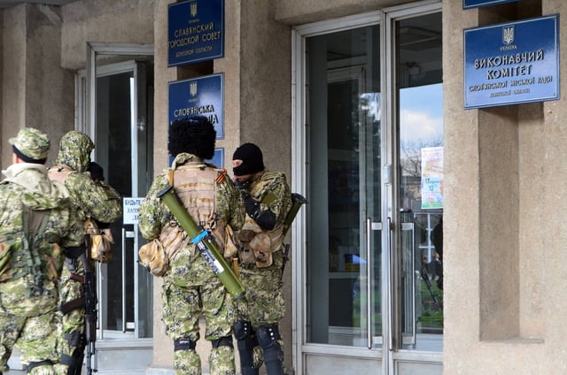 Sloviansk city council under control of masked men armed with Kalashnikov assault rifles and RPG-26 rocket launchers