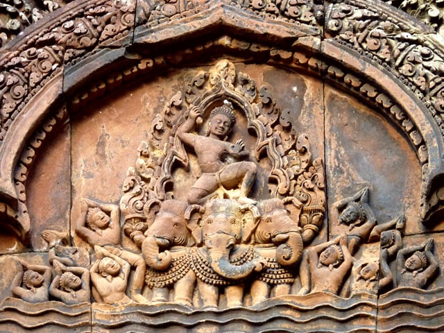 Banteay Srei temple's pediment carvings depict Indra mounts on Airavata, Cambodia.