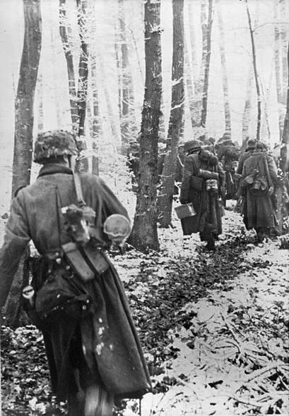 German infantry travel on foot in the Ardennes, December 1944