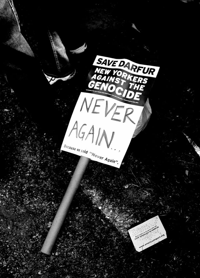 The Save Darfur Coalition advocacy group coordinated a large rally in New York in April 2006.  Depicted here is a discarded protest sign littering the street.