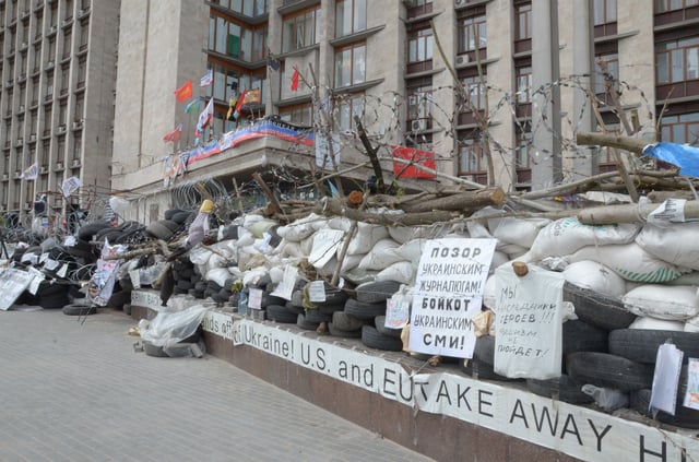 The barricade outside Donetsk RSA featuring anti-western slogans.