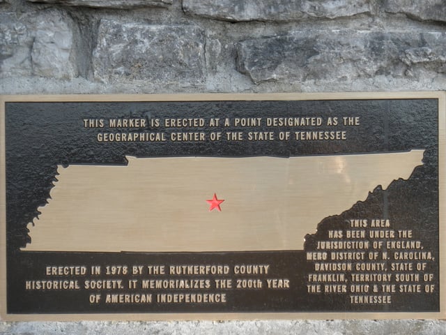 Plaque on a stone monument erected in 1978 designating the geographic center of Tennessee.