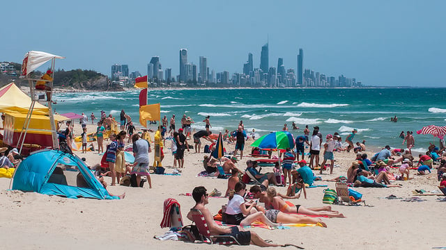 Summer at Burleigh Heads beach with the Gold Coast skyline in the distance. Gold Coast beaches are world-renowned.