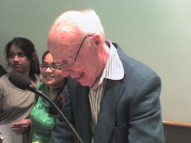 Watson signing autographs after a speech at Cold Spring Harbor Laboratory on April 30, 2007