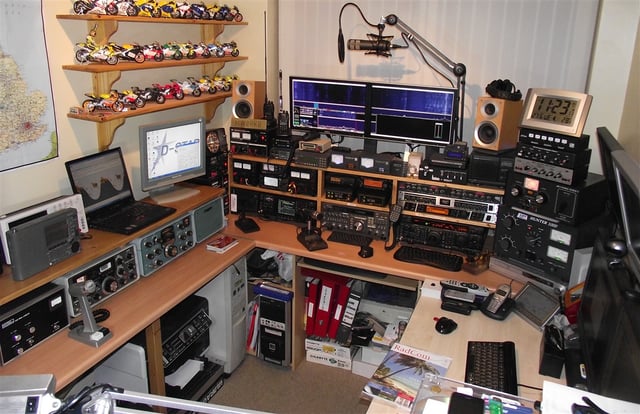 An amateur radio station in Wales. Multiple transceivers are employed for different bands and modes. Computers are used for control, datamodes, SDR, RTTY and logging.