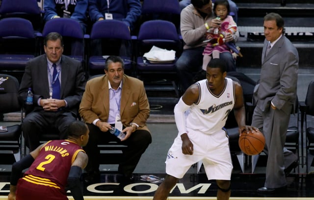 Owner Ted Leonsis and then coach Flip Saunders watch John Wall in 2010.