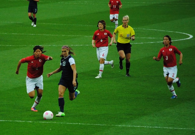 Morgan challenges Japanese defender Saki Kumagai for the ball as Mizuho Sakaguchi (6) and Azusa Iwashimizu (3) look on during their gold medal match at the 2012 Summer Olympics