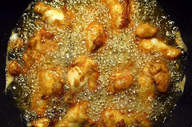 Frying chicken upper wings in corn oil