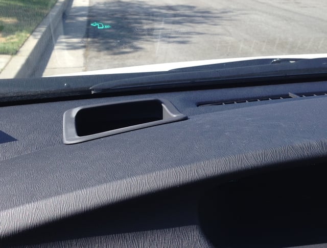 The green arrow on the windshield near the top of this picture is a Head-Up Display on a 2013 Toyota Prius. It toggles between the GPS navigation instruction arrow and the speedometer. The arrow is animated to appear scrolling forward as the car approaches the turn. The image is projected without any kind of glass combiner.