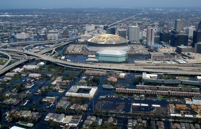 An aerial view from a United States Navy helicopter showing floodwaters around the Louisiana Superdome (stadium) and surrounding area (2005)