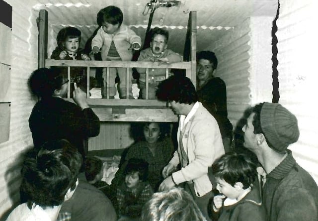 People in a bomb shelter at Kibbutz Dan