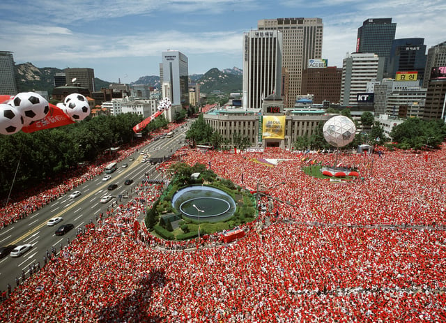 South Koreans watching their nation on the big screens in Seoul Plaza during the 2002 World Cup when they became the first Asian country to reach the semi-finals.