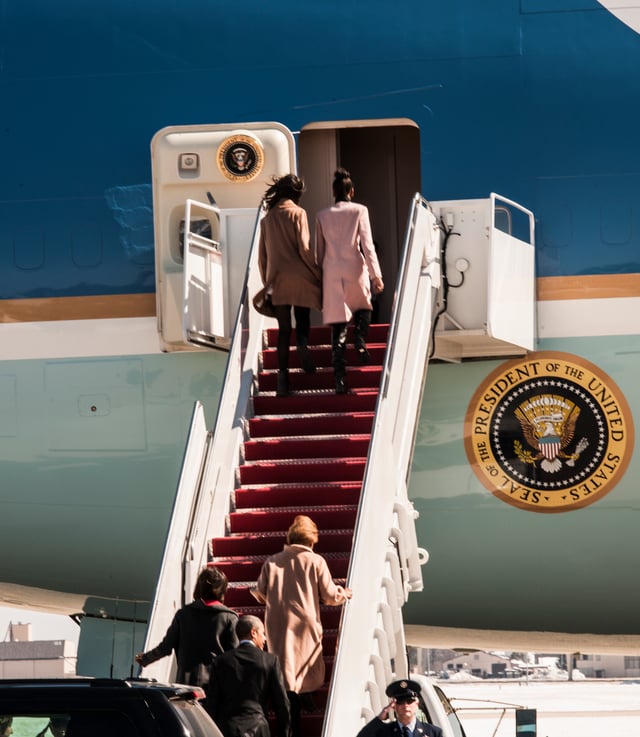 Malia and Sasha Obama prepare to enter Air Force One, Michelle Obama and President Obama behind them, on March 7, 2015.