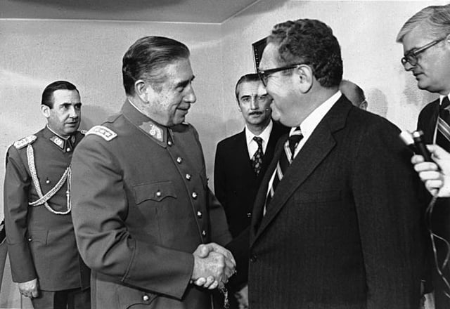 Chilean dictator Augusto Pinochet shaking hands with U.S. Secretary of State Henry Kissinger in 1976