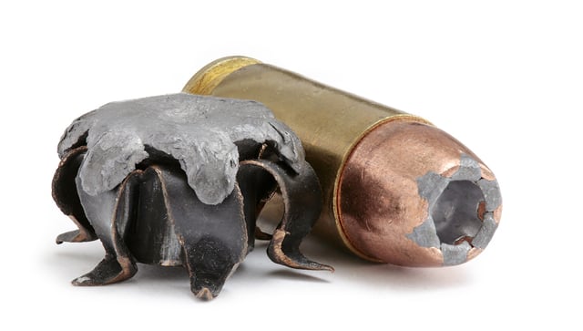 right: .40 S&W round with hollow-point bullet, left: expanded bullet of the same calibre with exposed lead core
