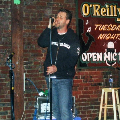 Crowe singing at an open mic night at O'Reilly's Pub in St. John's, Newfoundland. 13 June 2005