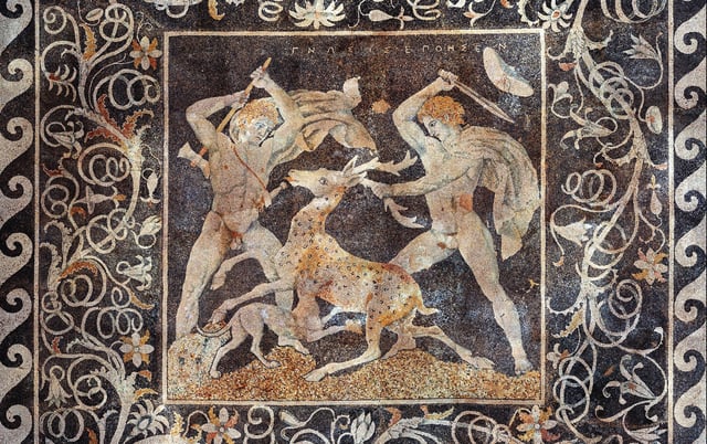 The Stag Hunt Mosaic, c. 300 BC, from Pella; the figure on the right is possibly Alexander the Great due to the date of the mosaic along with the depicted upsweep of his centrally-parted hair (anastole); the figure on the left wielding a double-edged axe (associated with Hephaistos) is perhaps Hephaestion, one of Alexander's loyal companions.
