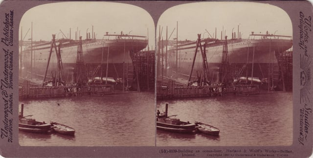 A 1907 stereoscope postcard depicting the construction of a passenger liner (the RMS Adriatic) at the Harland and Wolff shipyard