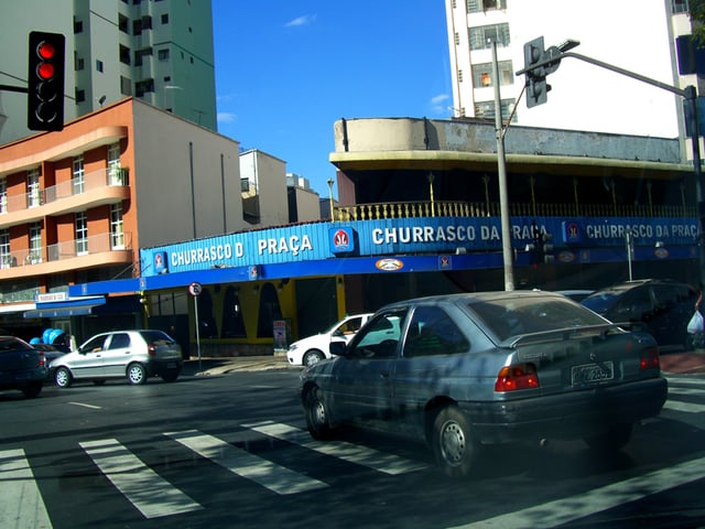 A driver comes to a stop on the crosswalk beyond the stop line as a result of attempting to avoid a red light violation