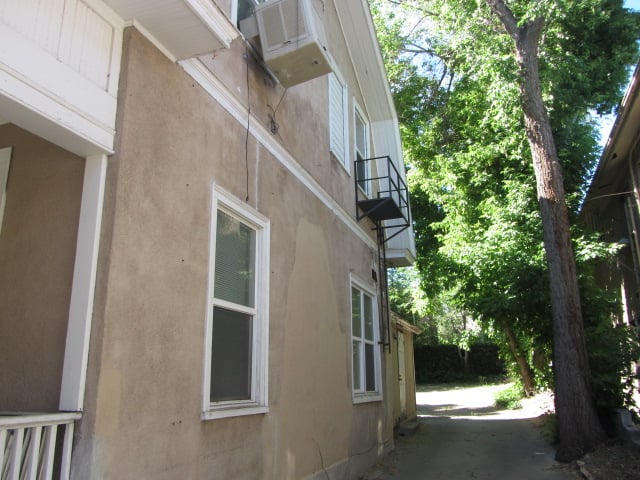 Rooming house in Salt Lake City where Bundy lived from Sept. 1974 to Oct. 1975, showing the fire escape used to sneak into his room and windows to the utility room where he concealed photo souvenirs of his murders