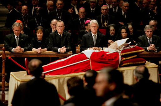 (l-r) George W. Bush, Laura Bush, George H. W. Bush, Bill Clinton, Condoleezza Rice, and Andrew Card, US dignitaries paying respects to John Paul II on 6 April 2005 at St. Peter's Basilica, Vatican City
