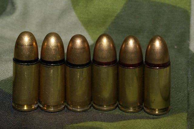 9mm live ammunition m/39 (left, with black seal) and m/39B (right, with red seal and a slightly more pointed shape)