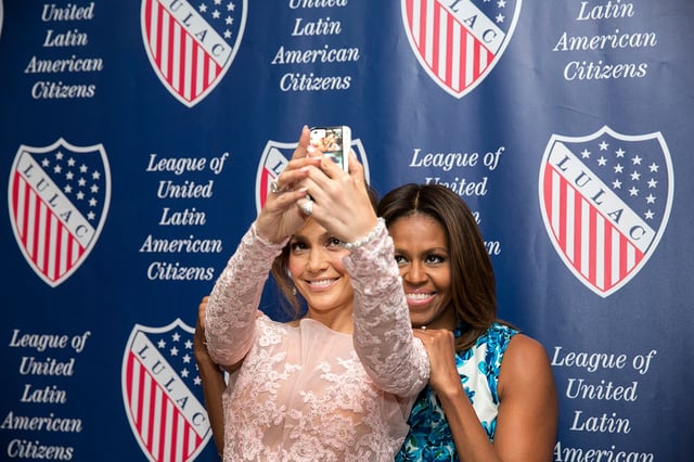 Lopez and First Lady Michelle Obama posing for a selfie at the League of United Latin American Citizens National Convention and Exposition in 2014.