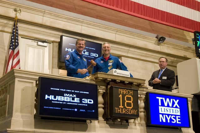 NASA astronauts Scott Altman and Mike Massimino ring the 'closing bell'.