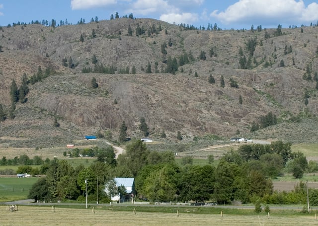 A farm and barren hills near Riverside, in north central Washington