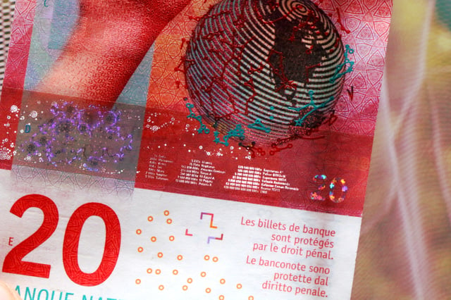 Fine print of a CHF 20 banknote: distances between earth and various celestial bodies, in Light-seconds