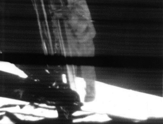 A mounted slowscan TV camera showing Armstrong as he climbs down the ladder to surface