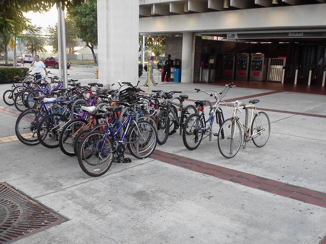 A busy bike and ride rack at Brickell station. Some stations have bike lockers; bicycles are also allowed on the trains.