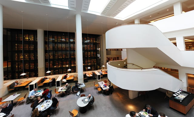 Interior of the British Library, with the smoked glass wall of the King's Library in the background.