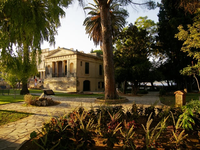 The Garden of the People at the Palace of St. Michael and St. George (Palaia Anaktora) with the Ionian Sea in the background.