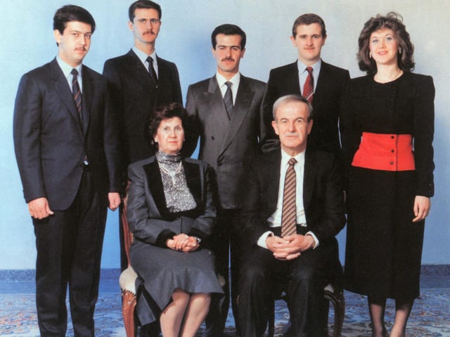 The al-Assad family, c. 1993. At the front are Hafez and his wife, Anisa. At the back row, from left to right: Maher, Bashar, Bassel, Majd, and Bushra