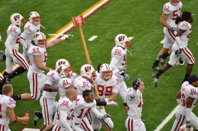 Badgers celebrate their win by carrying Paul Bunyan's Axe around Camp Randall after the 2009 game.