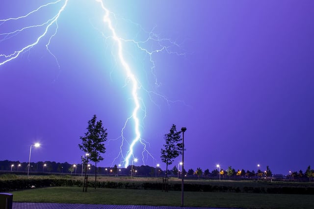 Lightning as an example of plasma present at Earth's surface: Typically, lightning discharges 30 kiloamperes at up to 100 megavolts, and emits radio waves, light, X- and even gamma rays. Plasma temperatures can approach 30000 K and electron densities may exceed 1024 m−3.