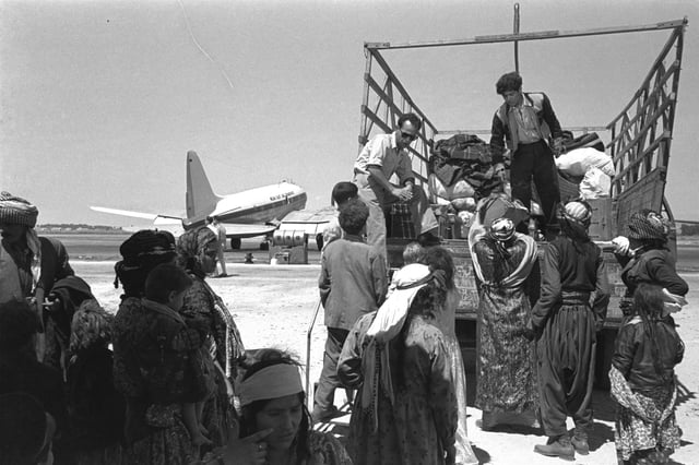 Kurdish Jewish Immigrants from Iraq leaving Lod Airport (1951).