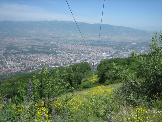 Skopje as seen from Mount Vodno. The cable car cables are also visible.