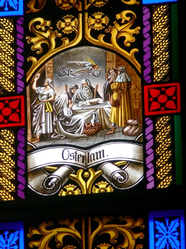 A stained-glass window depicting the Passover Lamb, a concept integral to the foundation of Easter