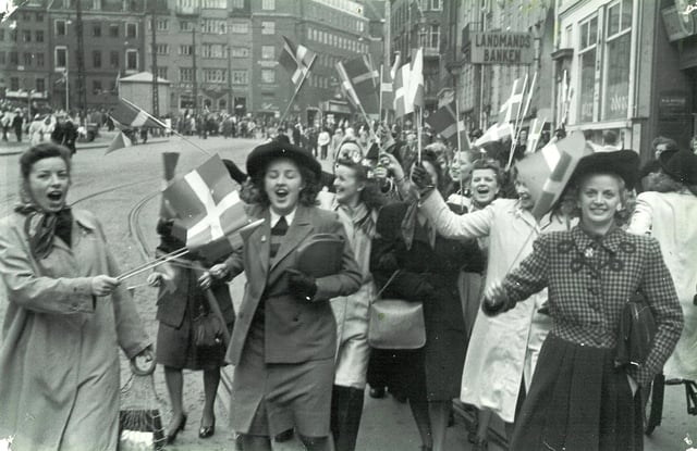 People celebrating the liberation of Denmark at Strøget in Copenhagen, 5 May 1945. Germany surrendered two days later