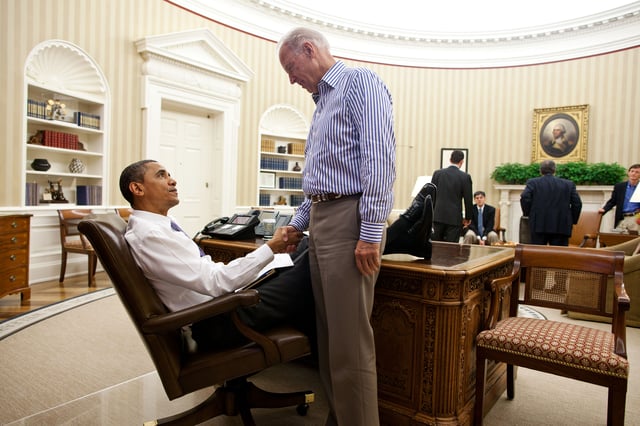 President Obama congratulates Biden for his role in shaping the debt ceiling deal that led to the Budget Control Act of 2011.
