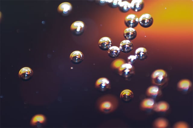 Carbon dioxide bubbles in a soft drink.