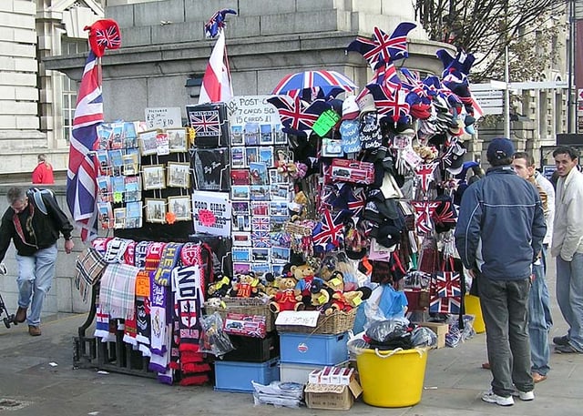 Sellers of souvenirs are typically located in high traffic areas such as this London souvenir stand situated near a railway station on a busy street corner