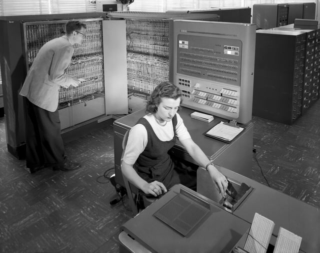NACA researchers using an IBM type 704 electronic data processing machine in 1957