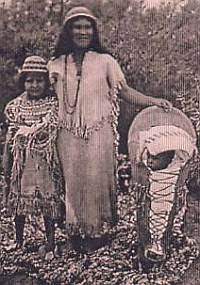 Southern Paiutes at Moapa wearing traditional Paiute basket hats with Paiute cradleboard and rabbit robe