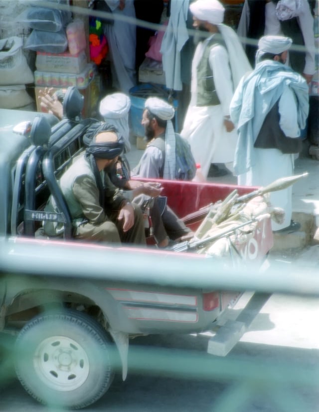 Taliban police patrolling the streets of Herat in a pickup truck