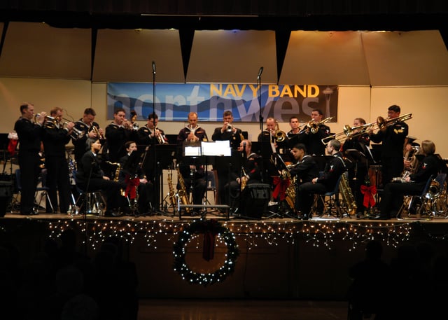 The United States Navy Band Northwest (NBNW) Big Band plays at a concert held in Oak Harbor High School.